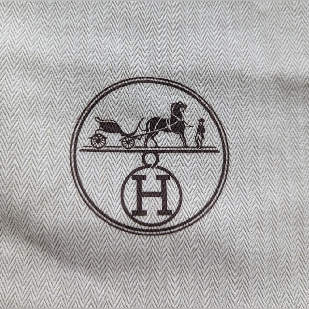 Authentic Hermes dust bag, 21cm long 21cm wide. Came with boutique purchase